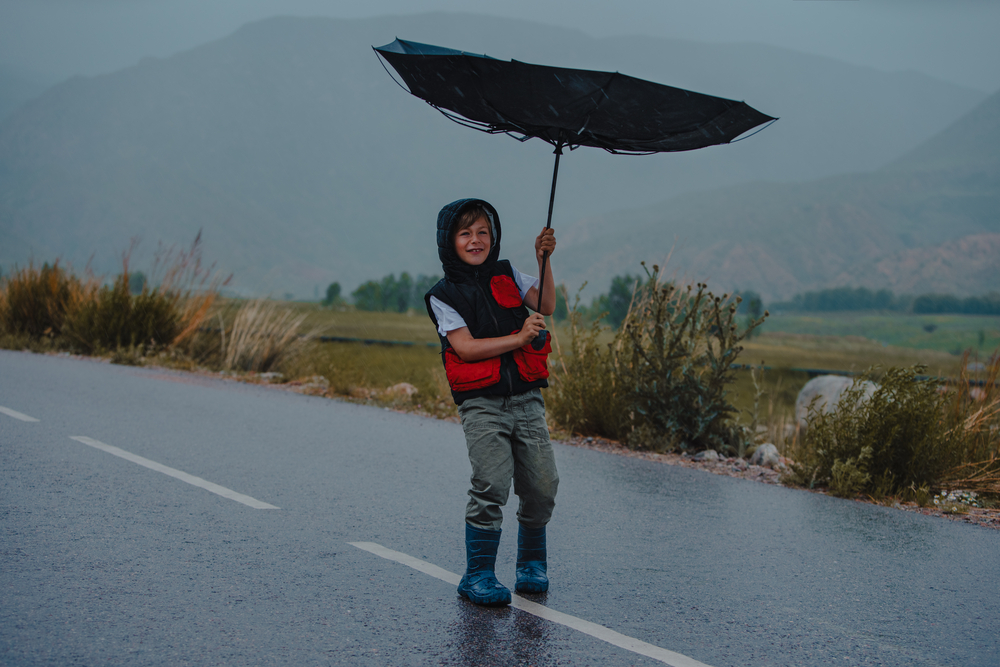 About Balance Counseling, weather, Mead Colorado, boy with umbrella on road